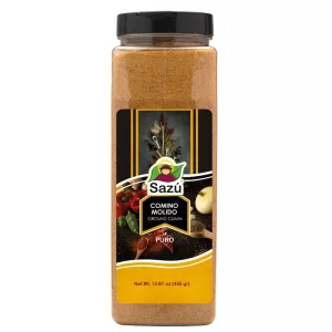 Comino molido Sazú 450 gr en tarro dosificador, condimento natural ideal para carnes, guisos, sopas, arroces y preparaciones típicas colombianas.